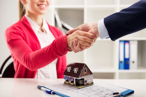 Property manager shaking hands with a client