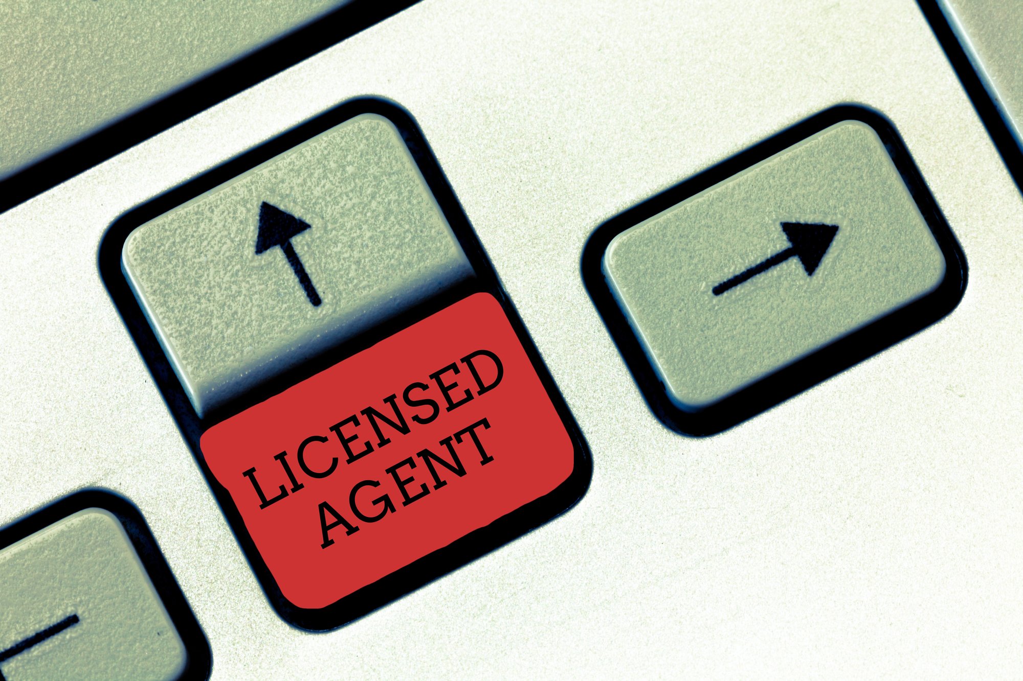 Conceptual hand writing showing Licensed Agent