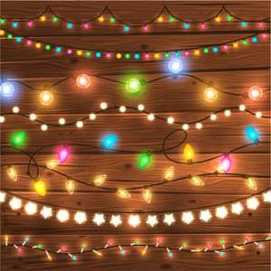 multiple strings of Christmas lights in front of a wood background