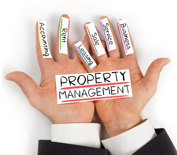 mans hand laid out with pillars of property management business