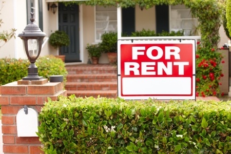 House With For Rent Sign in Front Yard
