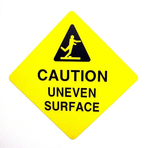 caution sign for uneven surface