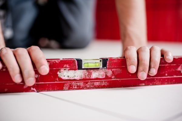 Man Using Leveler