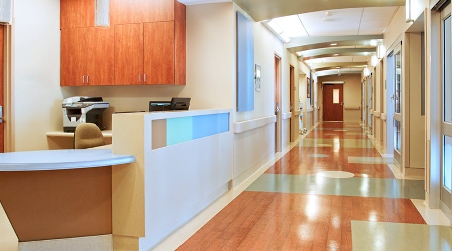 Empty Corridor And Nurse Station Desk In Modern Hospital Building 1
