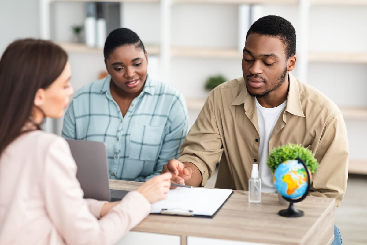 Two people having a meeting with a business woman