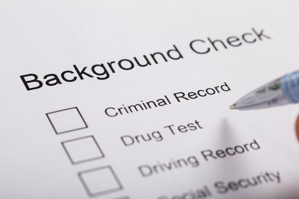 background check checklist and pen