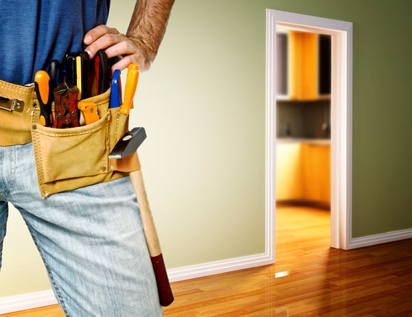 property management, handyman with tools on